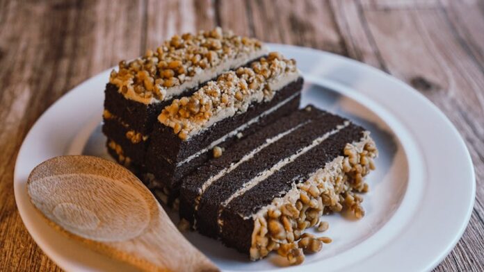Indulgent chocolate cake with nut topping, perfect for dessert lovers.