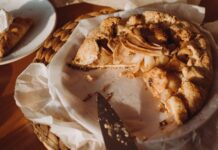 Delicious homemade apple galette on a rustic table setting, perfect for a cozy brunch or dessert.