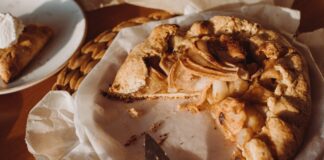 Delicious homemade apple galette on a rustic table setting, perfect for a cozy brunch or dessert.