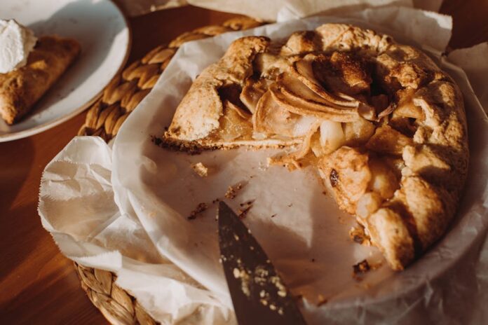 Delicious homemade apple galette on a rustic table setting, perfect for a cozy brunch or dessert.