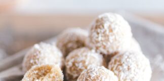 A close-up of coconut bliss balls on a linen cloth, showcasing their texture and sweet appeal.