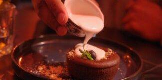 Decadent chocolate cake drizzled with coconut cream, perfect for dessert lovers.