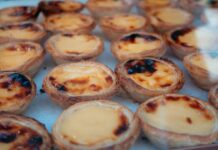 Close-up of delicious Portuguese custard tarts, perfect for dessert lovers.