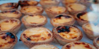 Close-up of delicious Portuguese custard tarts, perfect for dessert lovers.