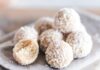 A close-up of coconut bliss balls on a linen cloth, showcasing their texture and sweet appeal.