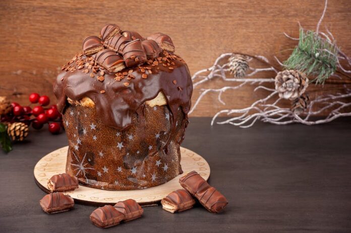 Descubra a Receita Secreta do Panetone de Chocolate Perfeito! Delicious chocolate panettone topped with Kinder Bueno, perfect for festive celebrations.