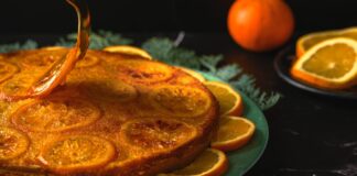 A beautifully decorated orange cake with candied orange slices, perfect for dessert lovers.