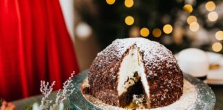 A delightful chocolate cake dusted with powdered sugar, perfect for festive gatherings.