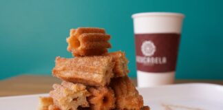 A tempting stack of cinnamon sugar churros with coffee in Azusa, California.