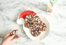 Delicious homemade crinkle cookies styled on a Santa-shaped plate with milk bottle.