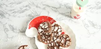 Delicious homemade crinkle cookies styled on a Santa-shaped plate with milk bottle.
