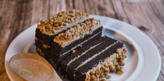Indulgent chocolate cake with nut topping, perfect for dessert lovers.