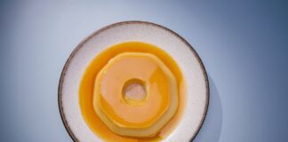 A delicious Brazilian flan on a white plate, perfect for food photography and culinary websites.