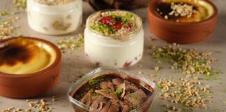 A selection of mouth-watering desserts including chocolate pudding and yogurt with nuts artfully arranged.