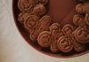 A close-up view of gingerbread men cookies arranged on a brown plate creating a festive atmosphere.