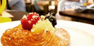 Tempting pastry topped with berries and cream, perfect for dessert lovers.