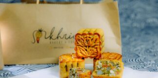 Close-up of beautifully designed mooncakes with intricate floral patterns, ideal for festive occasions.