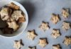 Flat lay of star-shaped homemade cookies in a bowl, perfect for Christmas treats.